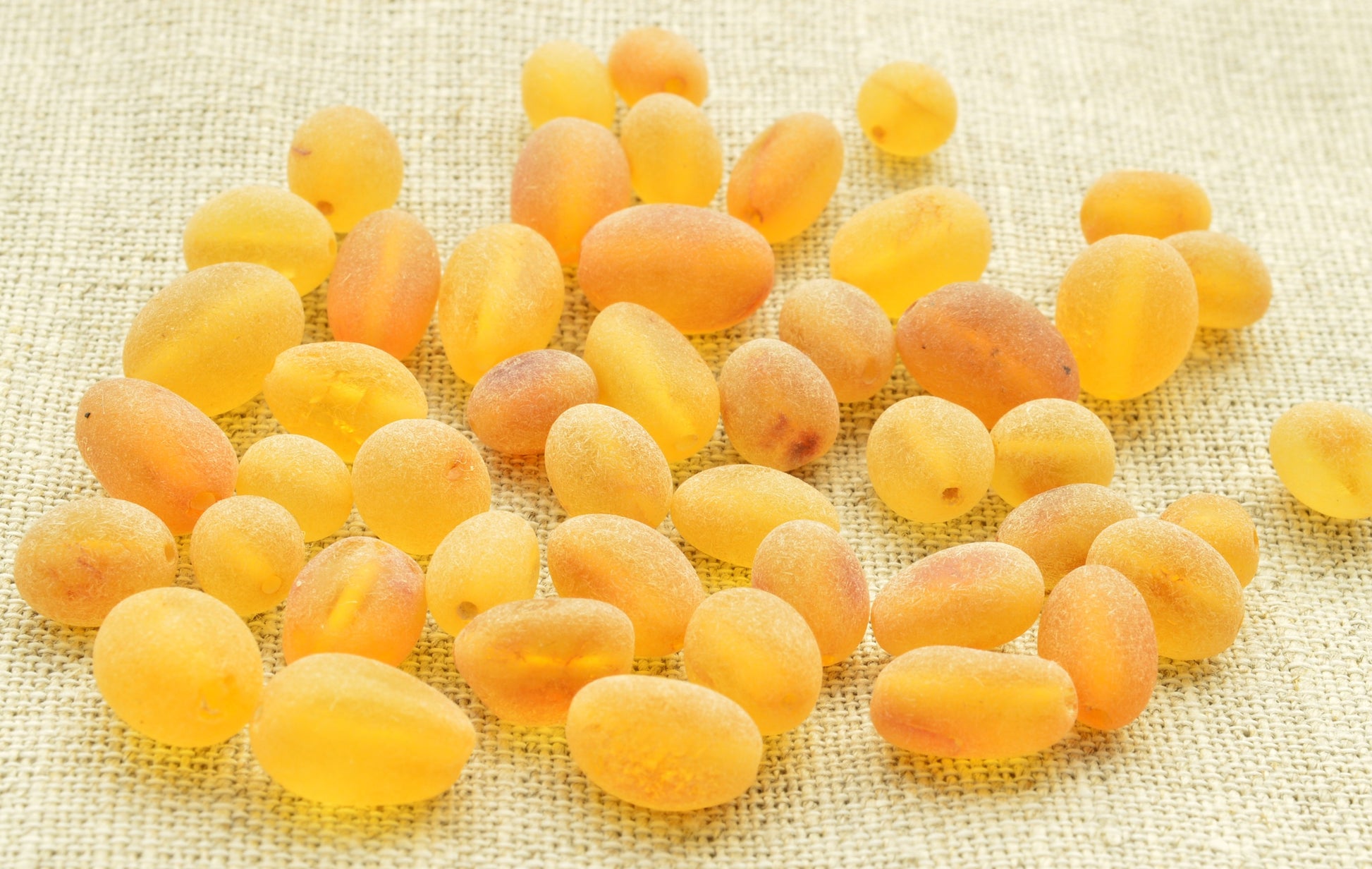 Yellow amber on a textured beige background